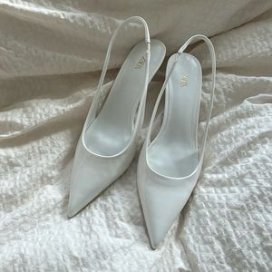White patent leather kitten heels